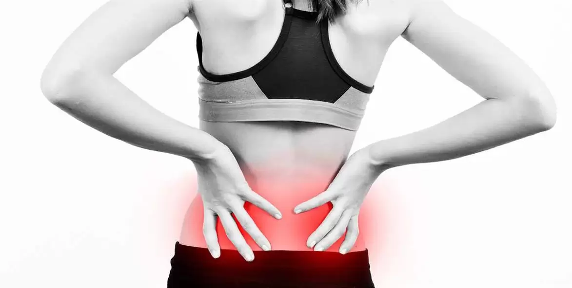 Pain in the lower back, which can be relieved with exercise and correct body position